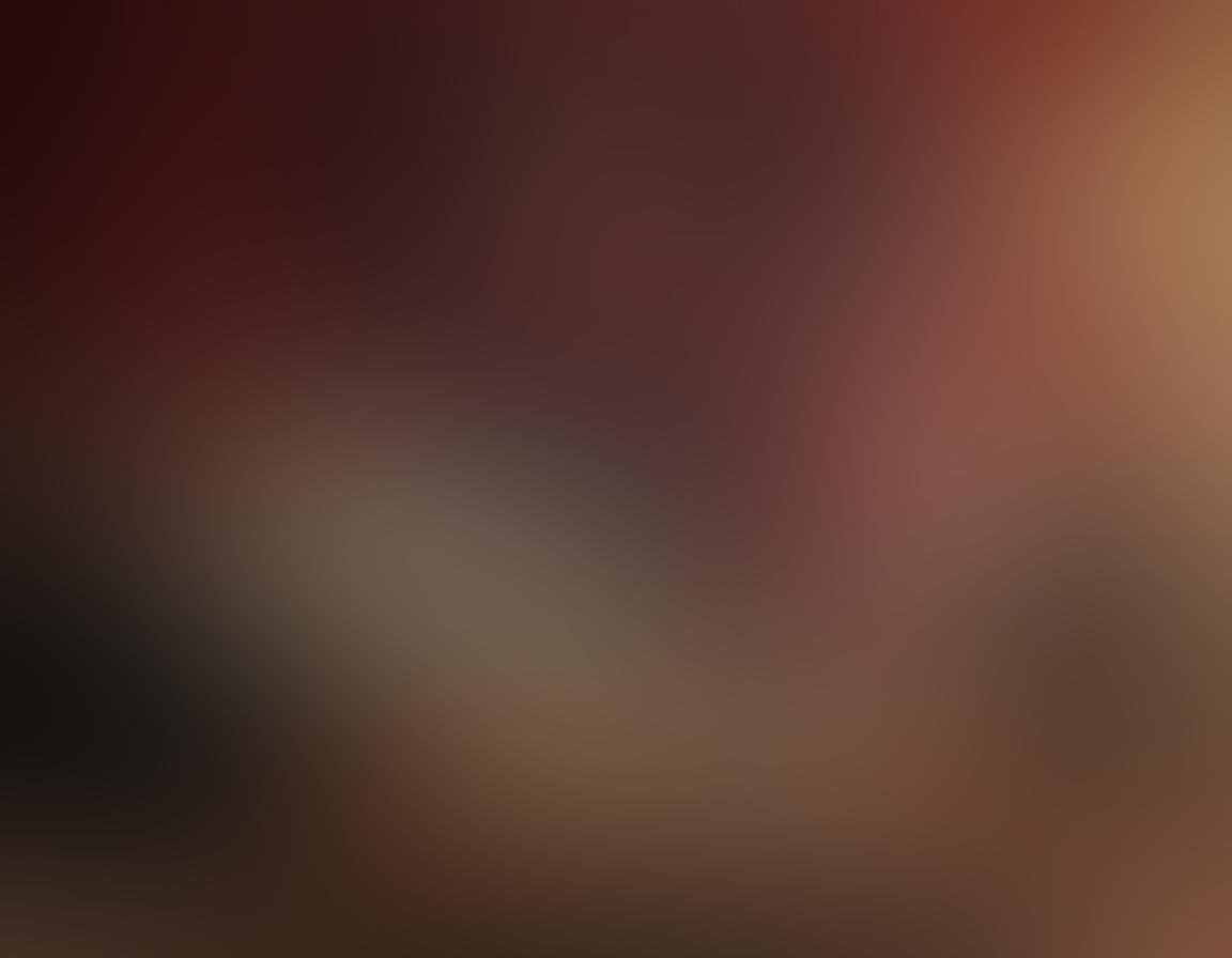 A cozy living room scene featuring a plush sofa and an elegant coffee table holding a bottle of red wine and two glasses, with movie tickets and popcorn beside them. A large screen in the background displays a classic film in vibrant color, adding warmth and nostalgia. Soft lighting from a vintage lamp casts a romantic glow, creating an inviting atmosphere. The overall mood should evoke a sense of relaxation and enjoyment, perfect for a movie night with wine. super-realistic. warm tones. cozy ambiance.